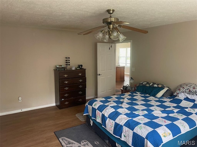 17035 Lanes End, Dixon, MO 65459 - bedroom featuring wood finished floors, a textured ceiling, and a ceiling fan