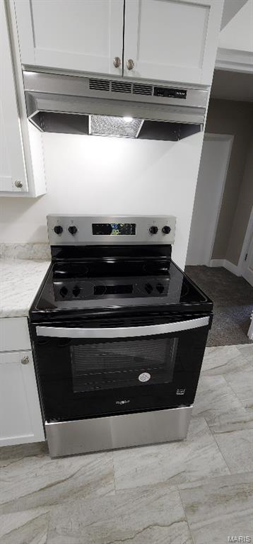 115 N 5th St, De Soto, MO 63020 - kitchen featuring stainless steel electric range oven, extractor fan, white cabinetry, and light stone counters