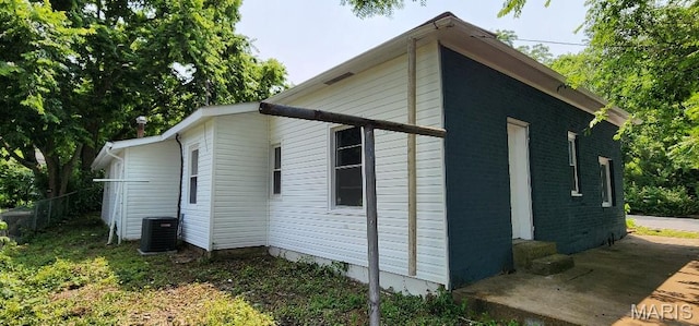 115 N 5th St, De Soto, MO 63020 - view of home's exterior featuring a central AC unit and entry steps