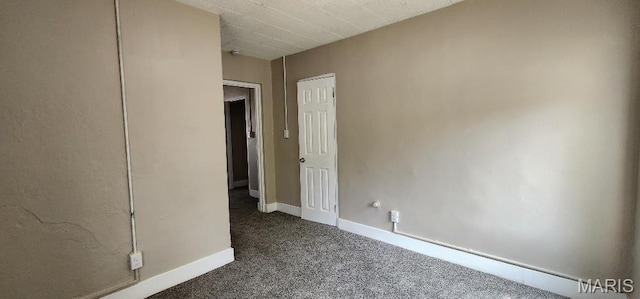 115 N 5th St, De Soto, MO 63020 - carpeted spare room with baseboards