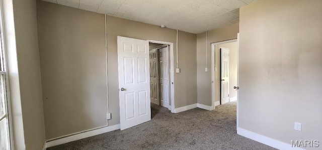 115 N 5th St, De Soto, MO 63020 - unfurnished bedroom featuring carpet flooring and baseboards