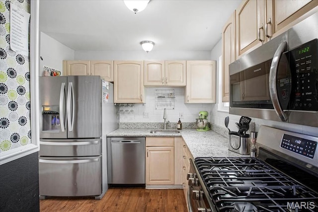 5 N Willow Grove Ct, Saint Peters, MO 63376 - kitchen with stainless steel appliances, light brown cabinets, dark wood-style floors, and light stone counters