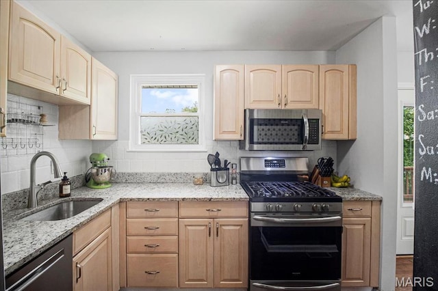 5 N Willow Grove Ct, Saint Peters, MO 63376 - kitchen featuring stainless steel appliances, light brown cabinets, decorative backsplash, and light stone countertops