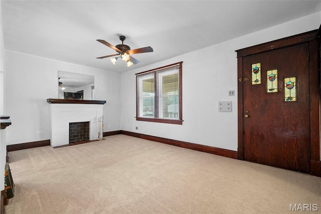 887 Wall St, Saint Louis, MO 63147 - unfurnished living room featuring carpet, ceiling fan, and a fireplace