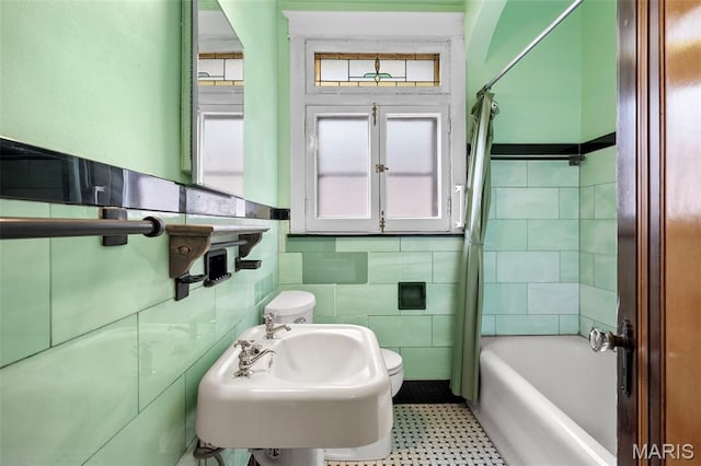 887 Wall St, Saint Louis, MO 63147 - full bathroom featuring tile walls and  shower combination