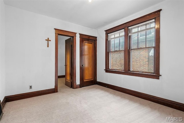 887 Wall St, Saint Louis, MO 63147 - unfurnished room featuring light colored carpet and baseboards