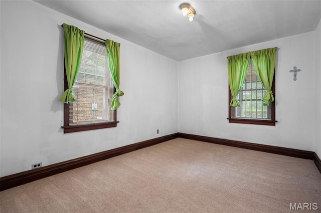 887 Wall St, Saint Louis, MO 63147 - carpeted spare room featuring baseboards