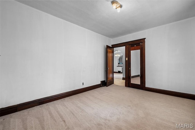 887 Wall St, Saint Louis, MO 63147 - empty room with carpet floors and baseboards