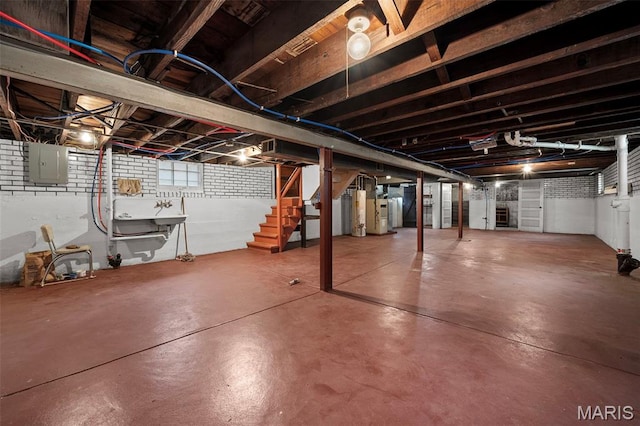 887 Wall St, Saint Louis, MO 63147 - below grade area featuring electric panel and stairway