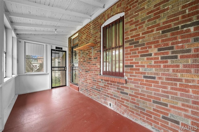 887 Wall St, Saint Louis, MO 63147 - unfurnished sunroom with beam ceiling and healthy amount of natural light