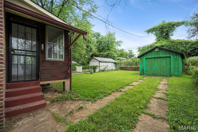 887 Wall St, Saint Louis, MO 63147 - view of yard with entry steps and a shed