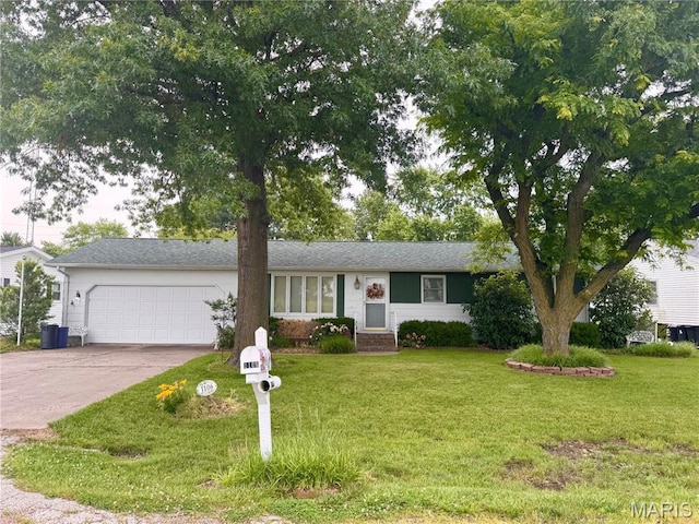 1106 N Oak St, Vandalia, MO 63382 - ranch-style house featuring a garage, concrete driveway, and a front lawn