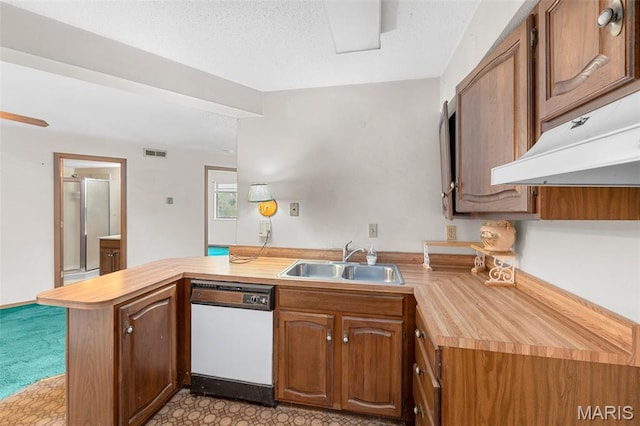 1514 Summer Run Dr Unit 208, Florissant, MO 63033 - kitchen featuring dishwasher, a peninsula, light colored carpet, custom range hood, and brown cabinets