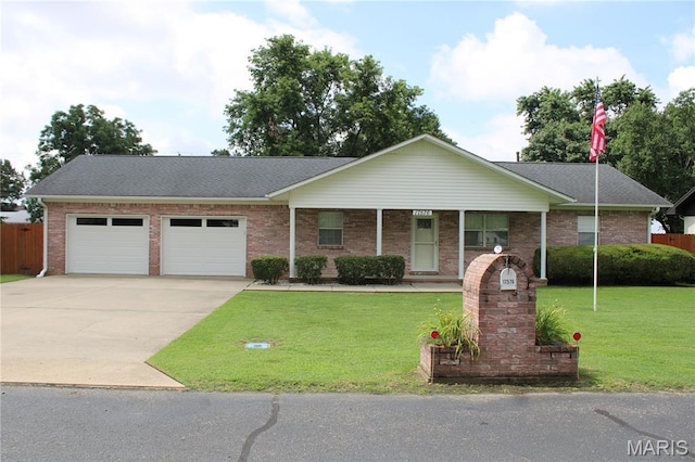 17576 Rigdon St, Kennett, MO 63857 - single story home with a garage, concrete driveway, and brick siding