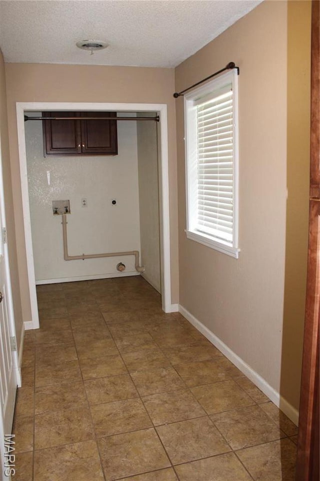17576 Rigdon St, Kennett, MO 63857 - laundry room with electric dryer hookup and a textured ceiling