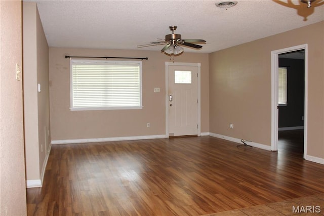 17576 Rigdon St, Kennett, MO 63857 - foyer featuring a ceiling fan, wood finished floors, and a textured ceiling