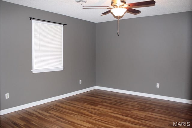 17576 Rigdon St, Kennett, MO 63857 - unfurnished room with ceiling fan, dark wood-style floors, and a textured ceiling