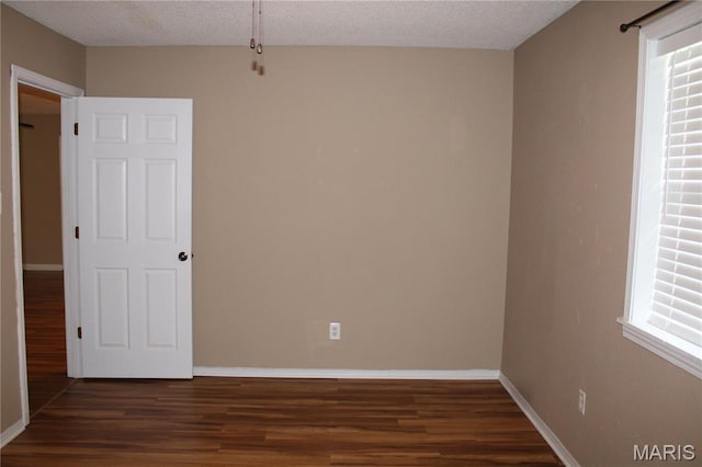 17576 Rigdon St, Kennett, MO 63857 - spare room with wood finished floors and a textured ceiling