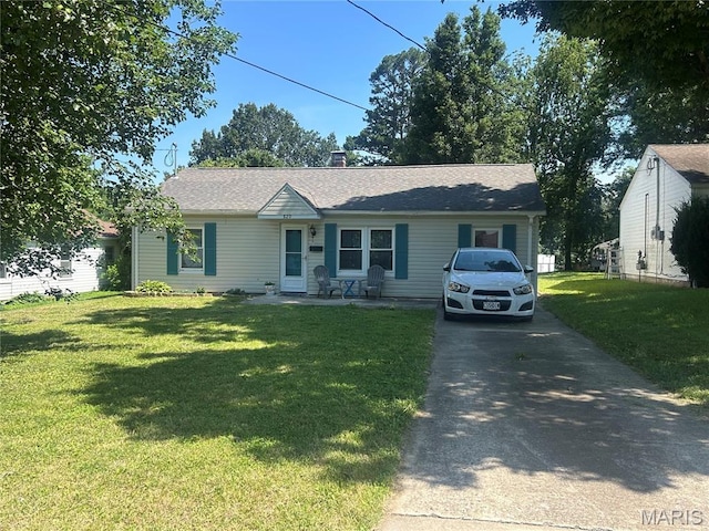 820 Dorothy Dr, Jackson, MO 63755 - view of front of home with a front lawn, concrete driveway, a chimney, and a shingled roof