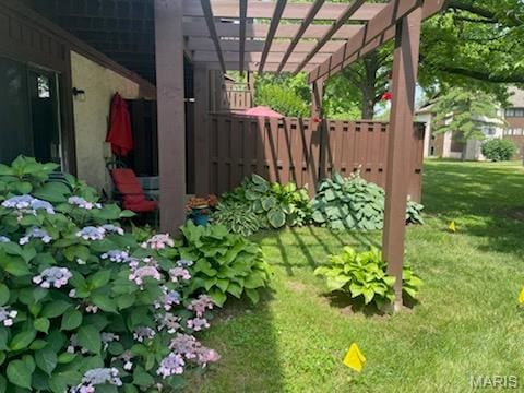 1400 Heritage Lndg Unit 109, Saint Charles, MO 63303 - view of yard featuring a pergola