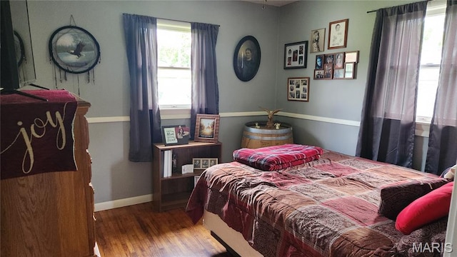 800 N Hickory St, Salem, MO 65560 - bedroom featuring wood finished floors and baseboards