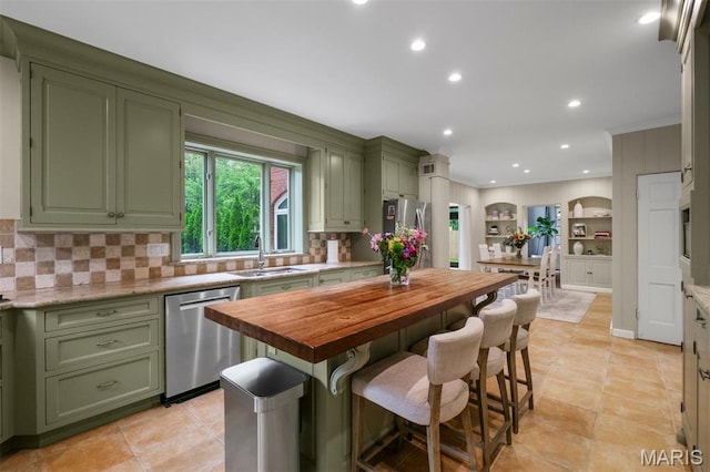 20 Ridgemoor Dr, Clayton, MO 63105 - kitchen featuring green cabinetry, stainless steel appliances, butcher block counters, backsplash, and recessed lighting