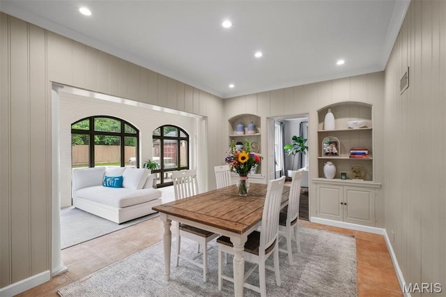 20 Ridgemoor Dr, Clayton, MO 63105 - dining space with ornamental molding, built in shelves, recessed lighting, wood walls, and light tile patterned flooring