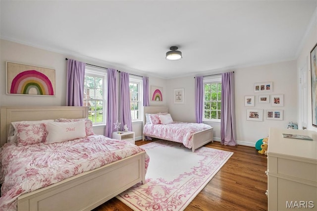 20 Ridgemoor Dr, Clayton, MO 63105 - bedroom featuring multiple windows, wood finished floors, and crown molding