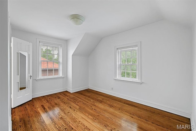20 Ridgemoor Dr, Clayton, MO 63105 - additional living space with vaulted ceiling, plenty of natural light, and wood finished floors