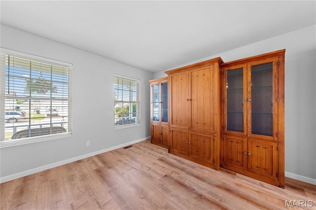 3924 Cambridge Crossing Dr, Saint Charles, MO 63304 - unfurnished bedroom with light wood-type flooring and baseboards