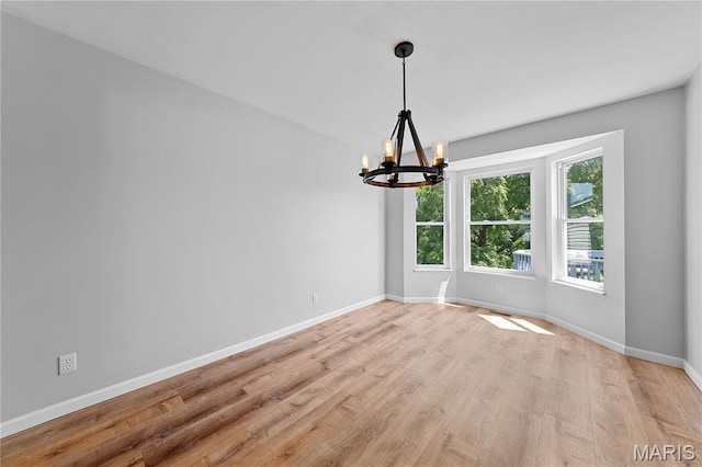 3924 Cambridge Crossing Dr, Saint Charles, MO 63304 - unfurnished room featuring a chandelier and light wood finished floors