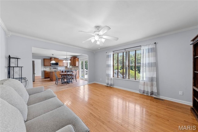 3924 Cambridge Crossing Dr, Saint Charles, MO 63304 - living area featuring a ceiling fan, ornamental molding, and light wood-type flooring
