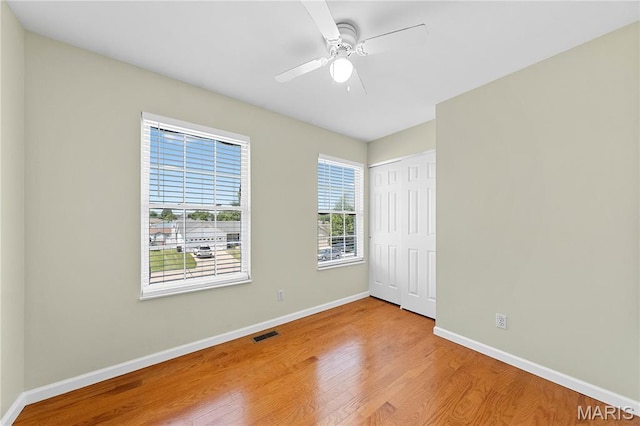 3924 Cambridge Crossing Dr, Saint Charles, MO 63304 - unfurnished bedroom featuring wood finished floors, a closet, and a ceiling fan