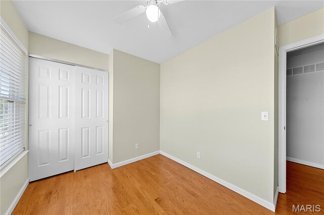 3924 Cambridge Crossing Dr, Saint Charles, MO 63304 - unfurnished bedroom featuring a closet, light wood-style flooring, and a ceiling fan