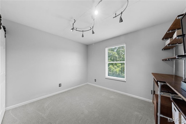 3924 Cambridge Crossing Dr, Saint Charles, MO 63304 - unfurnished office featuring carpet flooring, track lighting, and a barn door