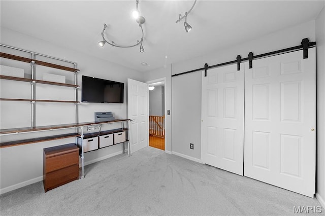 3924 Cambridge Crossing Dr, Saint Charles, MO 63304 - unfurnished bedroom featuring a barn door, carpet floors, and a closet