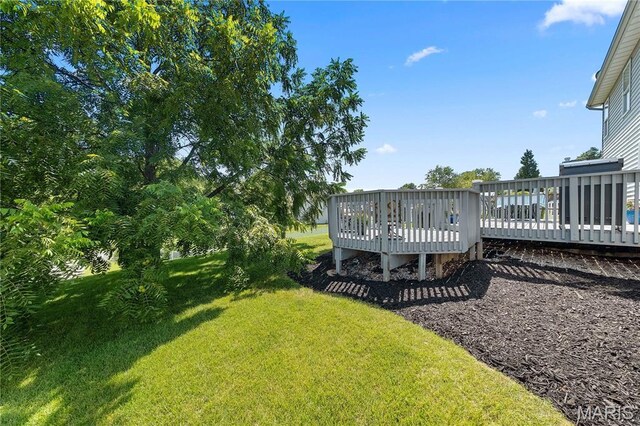 3924 Cambridge Crossing Dr, Saint Charles, MO 63304 - view of green lawn with a deck
