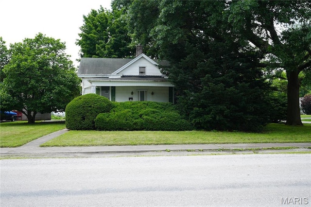 114 W 2nd St S, Mount Olive, IL 62069 - view of front facade with a front lawn and a chimney