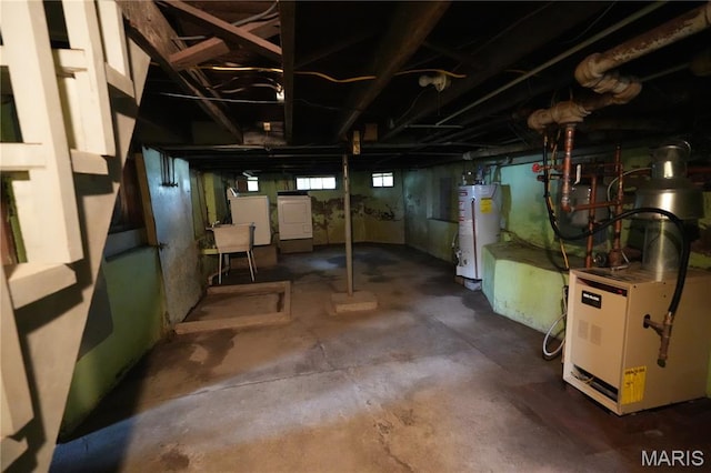 114 W 2nd St S, Mount Olive, IL 62069 - below grade area with gas water heater and washer and clothes dryer