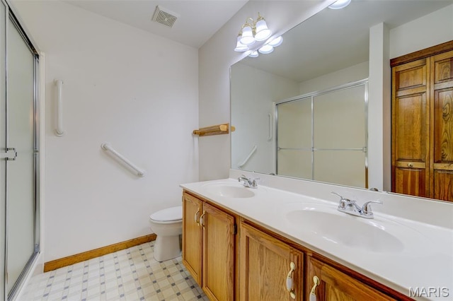3004 Oakmont Ct Unit 15C, Saint Charles, MO 63301 - bathroom featuring tile patterned floors, a stall shower, and double vanity