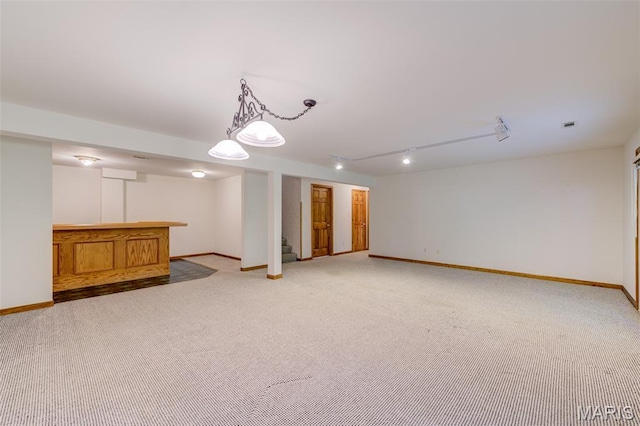 3004 Oakmont Ct Unit 15C, Saint Charles, MO 63301 - finished basement featuring light carpet, bar, rail lighting, and stairway
