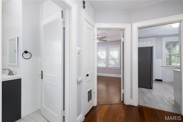 6162 W Park Ave, Saint Louis, MO 63139 - corridor featuring light wood-type flooring and plenty of natural light