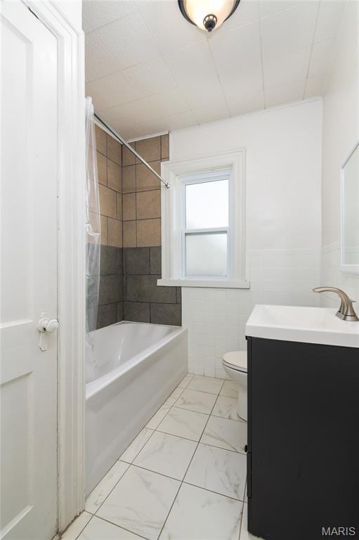 6162 W Park Ave, Saint Louis, MO 63139 - full bath with vanity, shower / washtub combination, and marble look tiles