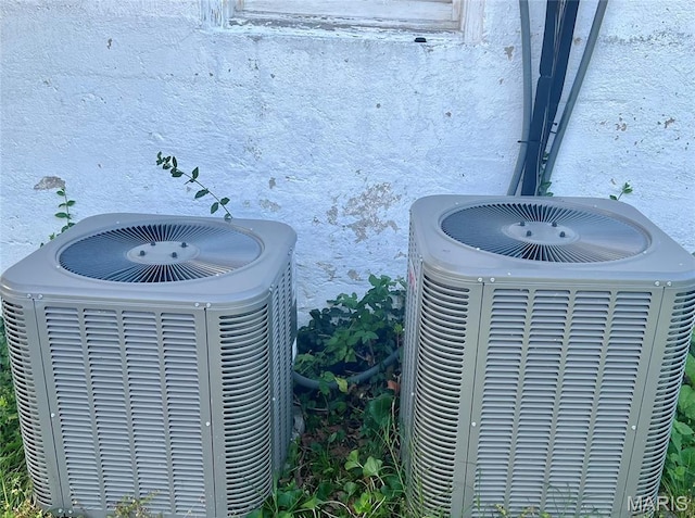 6162 W Park Ave, Saint Louis, MO 63139 - exterior view of a central air condition unit and stucco siding