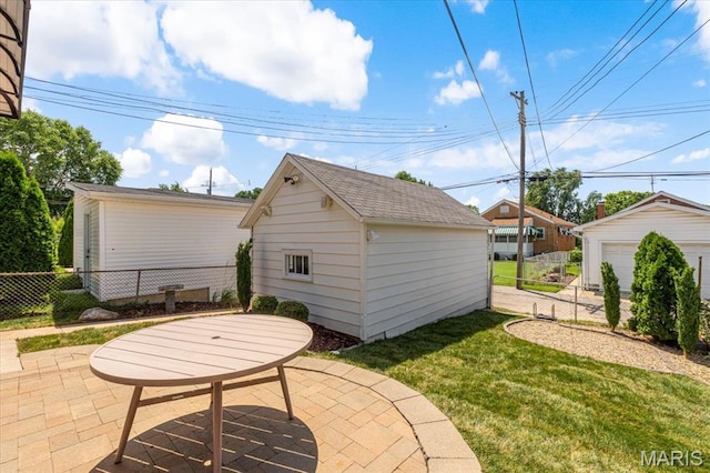 5660 Oleatha Ave, Saint Louis, MO 63139 - view of patio featuring an outdoor structure