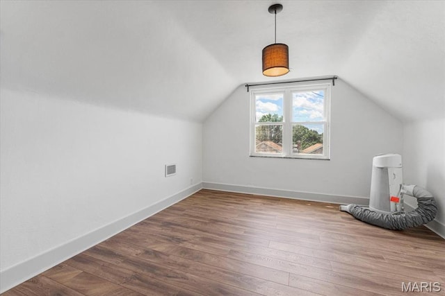 5660 Oleatha Ave, Saint Louis, MO 63139 - additional living space featuring wood finished floors and lofted ceiling