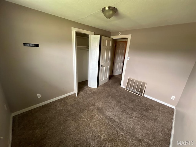 205 E Northview Ave, Wentzville, MO 63385 - unfurnished bedroom with dark carpet and a closet