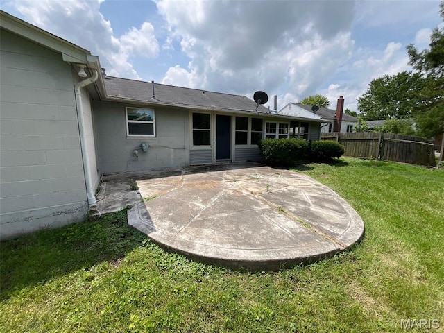 205 E Northview Ave, Wentzville, MO 63385 - back of house with a patio area and concrete block siding