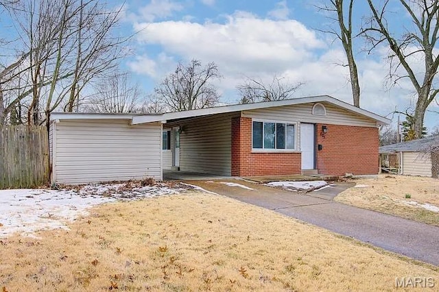 675 Pimlico Dr, Florissant, MO 63033 - view of front of property featuring an attached carport, brick siding, and asphalt driveway
