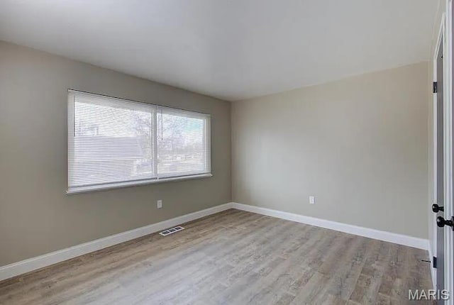 675 Pimlico Dr, Florissant, MO 63033 - unfurnished room with wood finished floors and baseboards
